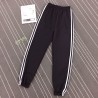 Pantaloni negri trening cu dungi albe